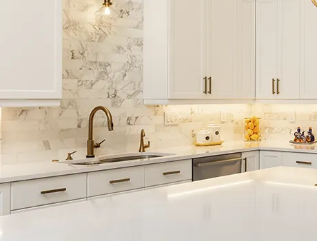 High-end quartz surfaces and solid wood cabinet samples from Premier Kitchen Cabinets.