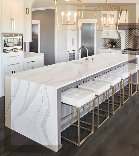 Luxury quartz waterfall kitchen island with grey veining and designer pendant lighting in Nashua, NH.